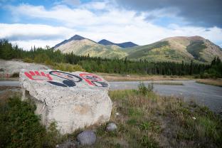 Violet Gatensby's commemorative art is painted on a chunk of concrete that was part of the steps of the Chooutla Residential School. 