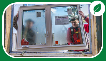 2 men installing a new window 2 men installing a new window