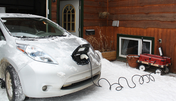 Used electric car plugged into house outlet Used electric car plugged into house outlet