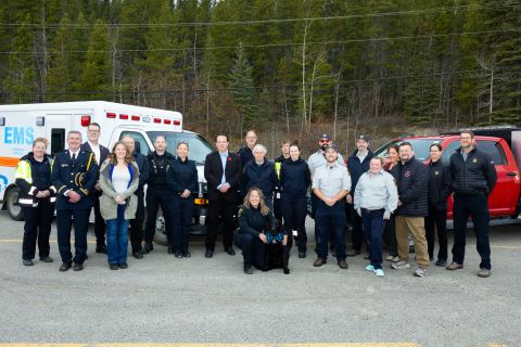 Dr. Tim Black, National Clinical Director, Wounded Warriors Canada, Minister of Community Services Cory Bellmore,  Minister of Health and Social Services Brad Cathers , Wendy Hafemeister Director of Wildland Fire Management, Greg Blackjack Director of Emergency Measures Organization and Devin Bailey Chief of Emergency Medical Services, pose alongside members of the Emergency Services units. The announcement of the the expansion of the partnership between the Government of Yukon and Wounded Warriors Canada t