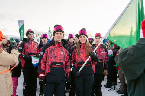 Brody Nash and Lia Hinchey lead Team Yukon into the opening ceremonies as flagbearers. Photo credit: Team Yukon | Sarah Lewis Photography. 