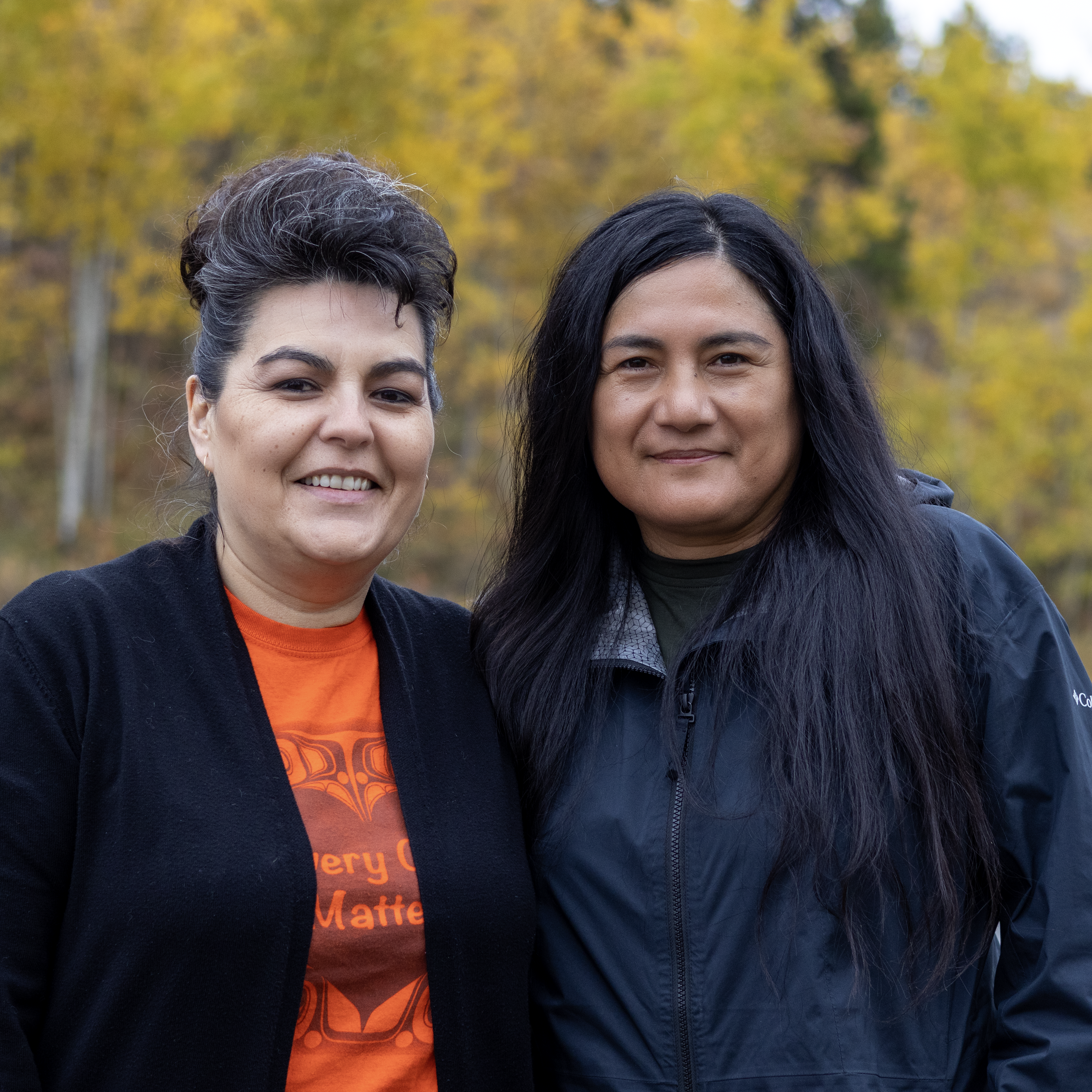Department of Education curriculum consultants Tammy Stoneman and Flora Asp are standing in the fall colours